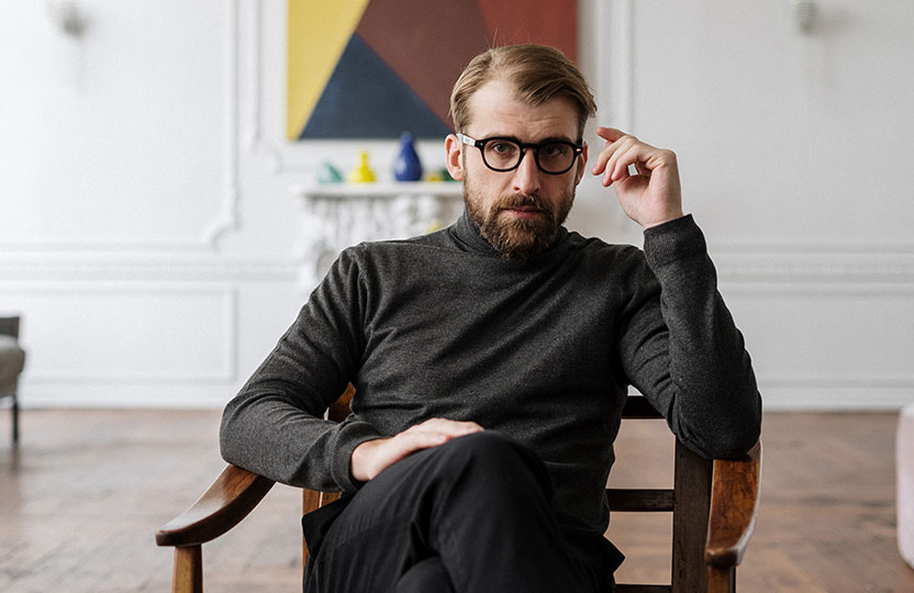 Man Sitting on Chair